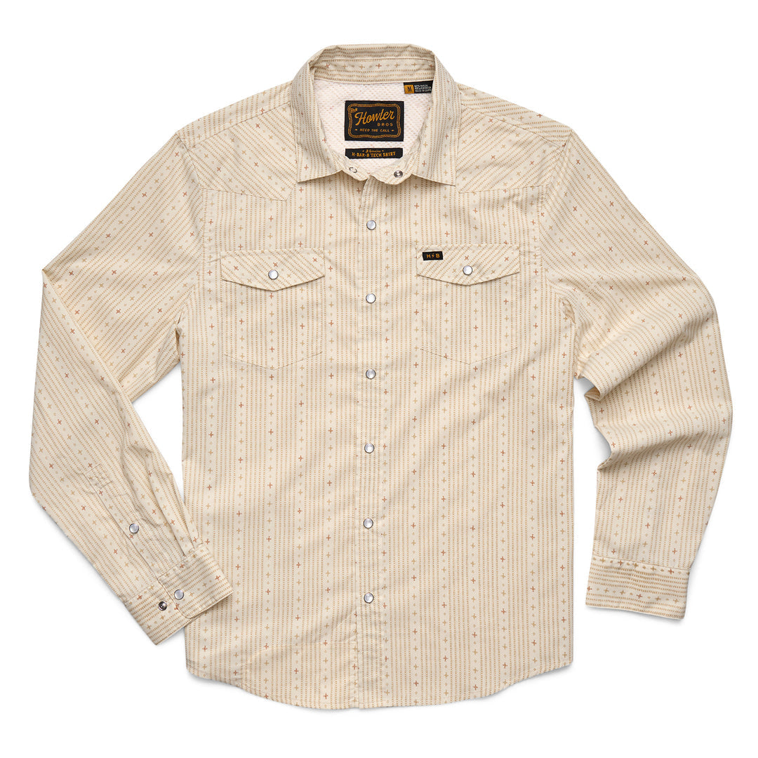 The Howler Brothers H Bar B Tech Long Sleeve shirt in beige features a subtle striped pattern, two chest pockets, and quick-drying stretch fabric for comfort.