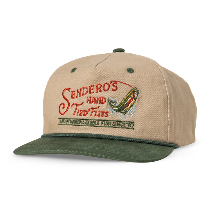 The Hand Tied Flies Hat by Sendero Provisions Co. features tan and green colors with an embroidered "Sendero's Hand Tied Flies" and a jumping fish—ideal for fishing fly enthusiasts.