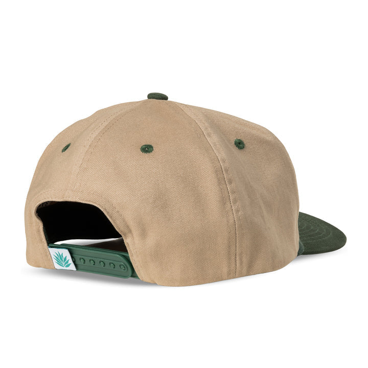 The Hand Tied Flies Hat by Sendero Provisions Co. is a tan and green baseball cap with an adjustable strap, small leaf logo, and embroidered fishing fly design.