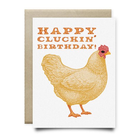 The "Happy Cluckin' Birthday" A2 greeting card by Anvil Cards features a hand-drawn chicken and bold orange text, printed on sustainable linen paper.