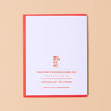 The Happy Valentines Day Card by And Here We Are features vintage lettering, a red border, and is hand letterpress printed. It highlights the woman-owned Columbus, Ohio business with contact info and “And Here We Are” at the top.