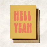 The Hell Yeah Card by Daydream Prints features bold pink "HELL YEAH" text on retro yellow, paired with a brown envelope—making it the perfect Congrats Card for any occasion.