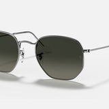 A pair of Ray-Ban 3548 Hexagonal Flat Arista sunglasses with geometric dark flat crystal lenses and thin silver metal frames displayed on a plain background.