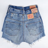 Three pairs of Vintage Denim Cutoff Shorts by Levis, stacked to show off the iconic back pockets and leather patches—a stylish, sustainable pick for denim lovers.