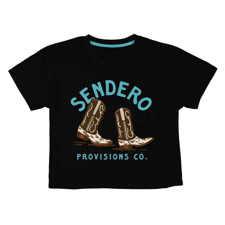The High Stepper Boxy Tee by Sendero Provisions Co. is a black, soft organic cotton shirt featuring two illustrated cowboy boots and "Sendero Provisions Co." in light blue text above and below the design. Easy fit for daily comfort.