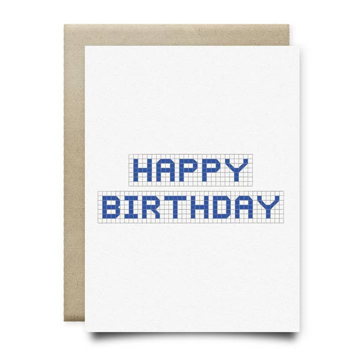 The Houston Blue Tile Birthday Card by Anvil Cards is a white A2 card with "HAPPY BIRTHDAY" in blue block letters on a grid, hand-drawn and paired with a brown envelope.