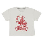 The Howdy Stranger Boxy Tee by Sendero Provisions Co. is an ultra-soft, organic cotton white t-shirt with a red cowboy skeleton graphic tipping its hat, holding a lasso, and "Howdy Stranger Sendero Provisions Co." text.