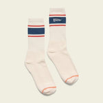Howler Brothers' Howler Script Socks are combed cotton crew socks with blue and red stripes, a "Howler" embroidery on a blue background, and vintage-inspired artwork for a classic athletic style.