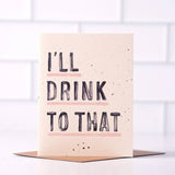 The "I'll Drink To That" card by Daydream Prints is a retro greeting card standing on an envelope—perfect as a funny congratulations or birthday card.