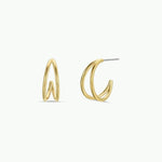 The Illusion Double Hoop by JaxKelly features 18k gold-plated, tarnish-free hoops with a modern, twisted design. Shown from front and side on a plain white background.
