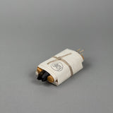 The Bath & Meditate Bundle by Incausa features incense sticks and charcoal, wrapped in white Nepalese Lokta paper and tied with string, displayed on a plain gray background.