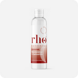 A clear plastic bottle labeled "Liposomal Curcumin + Resveratrol | Rho Nutrition," featuring a white cap and a red gradient design on the lower half, supports joint comfort with turmeric root extract.