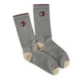 The Duck Head Logo Sock is a gray crew style with maroon trim, beige heels and toes, and a circular logo near the top. Made in the USA, these socks blend comfort, quality, and classic Duck Head style in every detail.