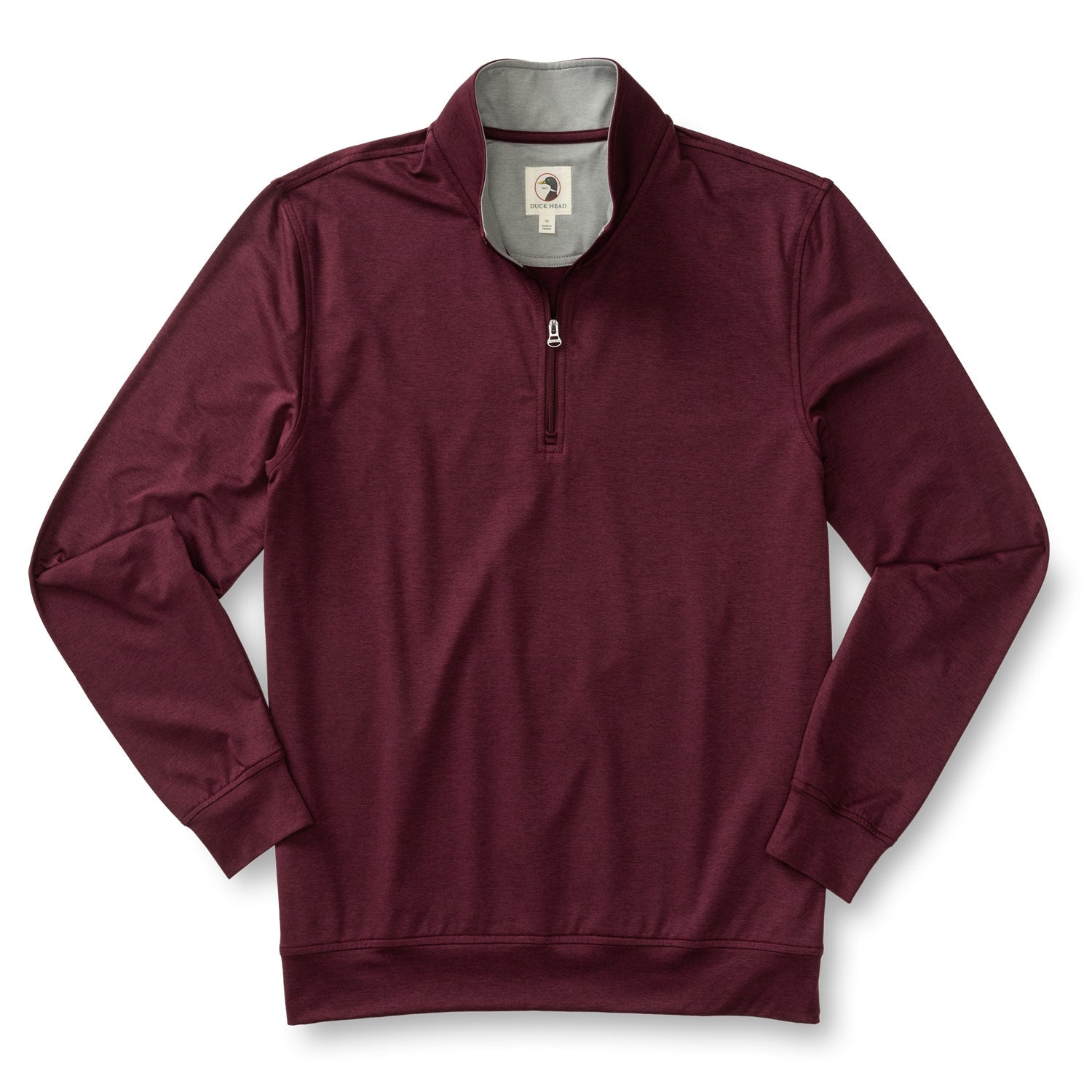 The Duck Head Long Drive Performance 1/4 Zip Pullover is a maroon long-sleeve with a standing collar, visible zipper, and inner logo tag—ideal golf apparel with moisture-wicking comfort on the course.