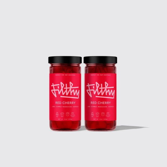Two glass jars with black lids contain Filthy Long Stemmed Maraschino Cherries. Each jar features a bright red label with bold white text—a perfect cocktail garnish from the Filthy brand.
