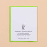 The Love you & Like you Card by And Here We Are is a white letterpress card with black text atop a green envelope. This woman-owned brand handmakes cards in Columbus, Ohio.