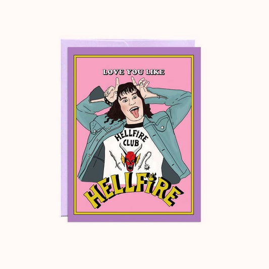 The "Love You Like Hell" A2 card by Party Mountain Paper co. features a figure in a denim jacket making devil horns, with "Love you like HELLFIRE" and "Hellfire Club" on their shirt. Blank inside—perfect for fiery Valentine's messages! Made in Canada.