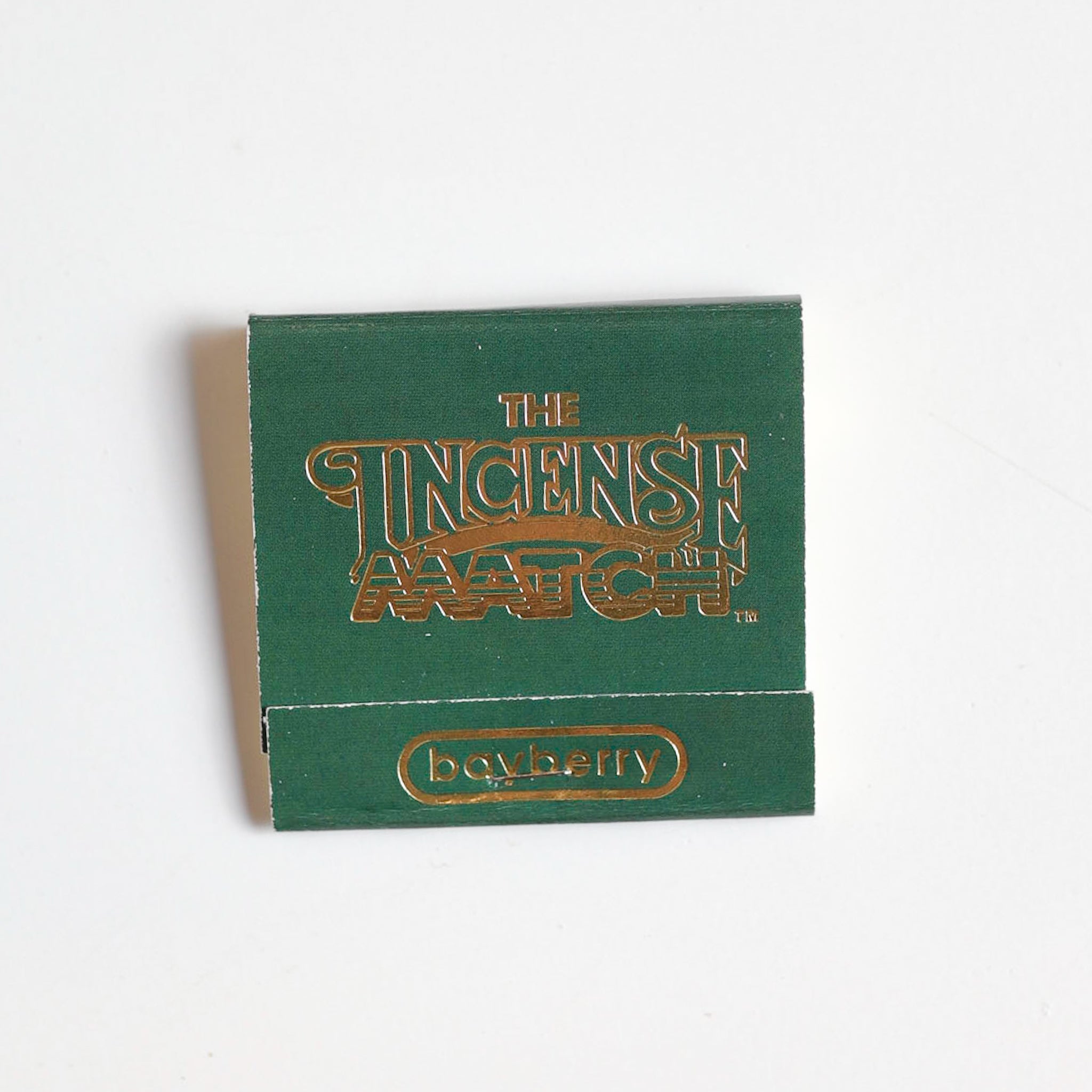 A green matchbook labeled "The Incense Match" by The Incense Match in bayberry scent—these portable incense matches freshen the air and make a great fragrance gift.