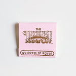 A pink booklet labeled "Matches | The Incense Match" by The Incense Match, featuring "goddess of egypt" at the bottom, is shown on a white background. This unique product works as both incense matches and an air freshener.