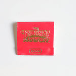 A red "Matches | The Incense Match" matchbook by The Incense Match with "Spice" in gold on the front, ideal as an incense gift or air freshener, displayed on a plain white background.