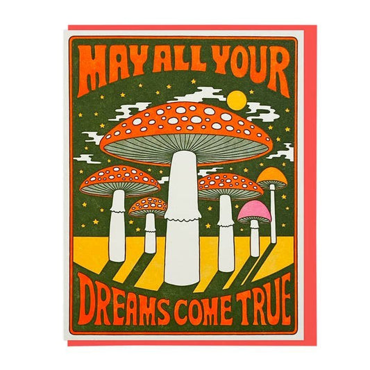The "May All Your Dreams Come True" greeting card by Lucky Horse Press features bold, retro lettering, red and white mushrooms under a sun and stars. Printed on recycled cover; blank inside for your message.