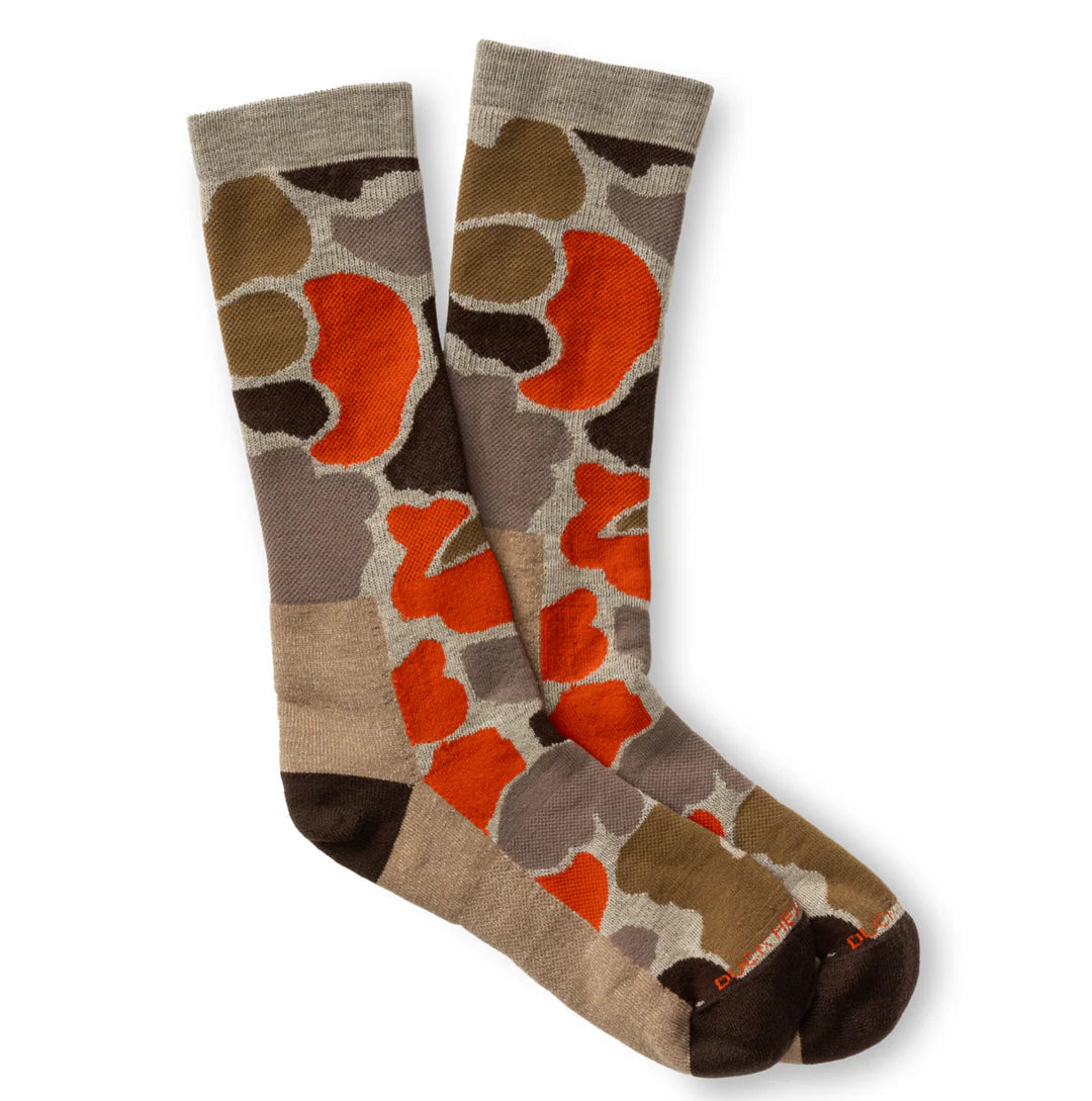 The Duck Head Merino Wool Sock is a crew-length pair with an abstract brown, orange, and beige pattern on a neutral background.