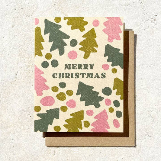 The "Merry Christmas Tree" card by Daydream Prints features festive abstract green trees and colorful shapes on a brown envelope—an ideal cheerful holiday greeting from Portland, Oregon.