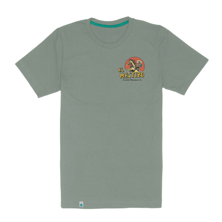 The Mestizo tee by Sendero Provisions Co. is a light green short-sleeve shirt featuring a small "El Mestizo" Wild West dinosaur graphic and text on the left chest.