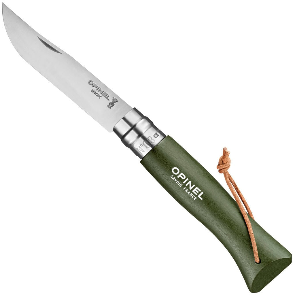 The Opinel No. 08 Colorama Forest Green folding knife features a stainless steel blade, green wooden handle, Virobloc safety ring, and a leather lanyard, displayed against a white background.
