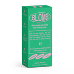 A green and pink "Blomb" box labeled No.11 Eau de Parfum features notes of grapefruit, tarragon, and sage, promising a long-lasting, clean, and refreshing natural scent.