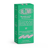 A green and pink "Blomb" box labeled No.11 Eau de Parfum features notes of grapefruit, tarragon, and sage, promising a long-lasting, clean, and refreshing natural scent.