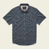 The Howler Brothers Open Country Tech Shirt in Rancher Floral features short sleeves, a dark blue floral print, two buttoned chest pockets, quick-dry fabric, and UPF 35 sun protection.