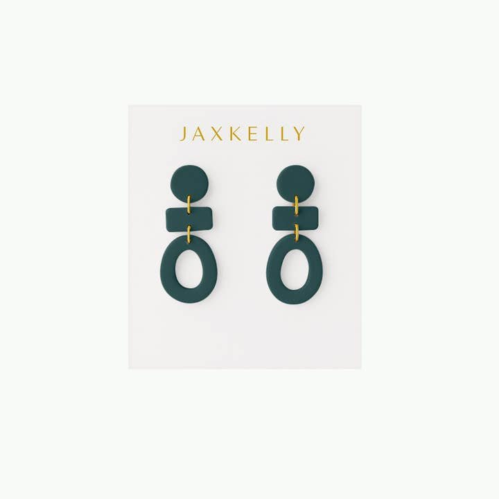 A pair of Organic Three Tier Clay Earrings in Evergreen by JaxKelly rests on a white card labeled "JaxKelly.