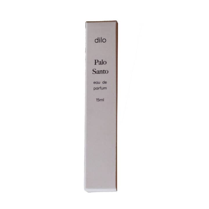 A rectangular white box labeled "Palo Santo Eau De Parfum | dilo" by dilo stands upright against a white background, featuring a fragrance inspired by Palo Santo.