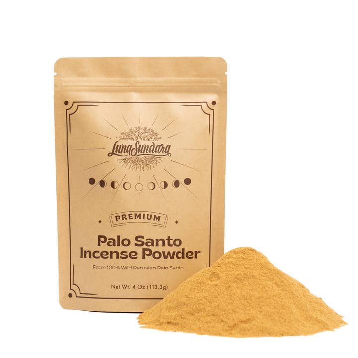 A brown pouch labeled "Palo Santo Incense Powder | Luna Sundara" stands upright beside a small pile of light brown powder on a white background, featuring a sustainably harvested, aromatic blend from Luna Sundara.