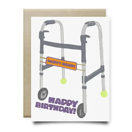 The Party Hard Walker Birthday Card by Anvil Cards features a hand-drawn walker with tennis balls, a "Party Hard!" sign, and "Happy Birthday!" on sustainable linen A2 cardstock.
