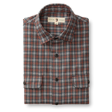 The Duck Head Performance Flannel Sport Shirt features gray, blue, and red plaid with black buttons and two front pockets, displayed folded on a white background—ideal as a moisture-wicking outdoor hiking or everyday shirt.