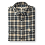 The Duck Head Performance Flannel Sport Shirt is a folded, long-sleeve plaid shirt in blue, beige, and brown with a collar, button front, and two chest pockets—crafted from moisture-wicking performance flannel for comfort.