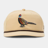 The Duck Camp Pheasant Hat is a beige snapback with a brown band, an embroidered pheasant on the front, adjustable fit, and durable polyester shell.