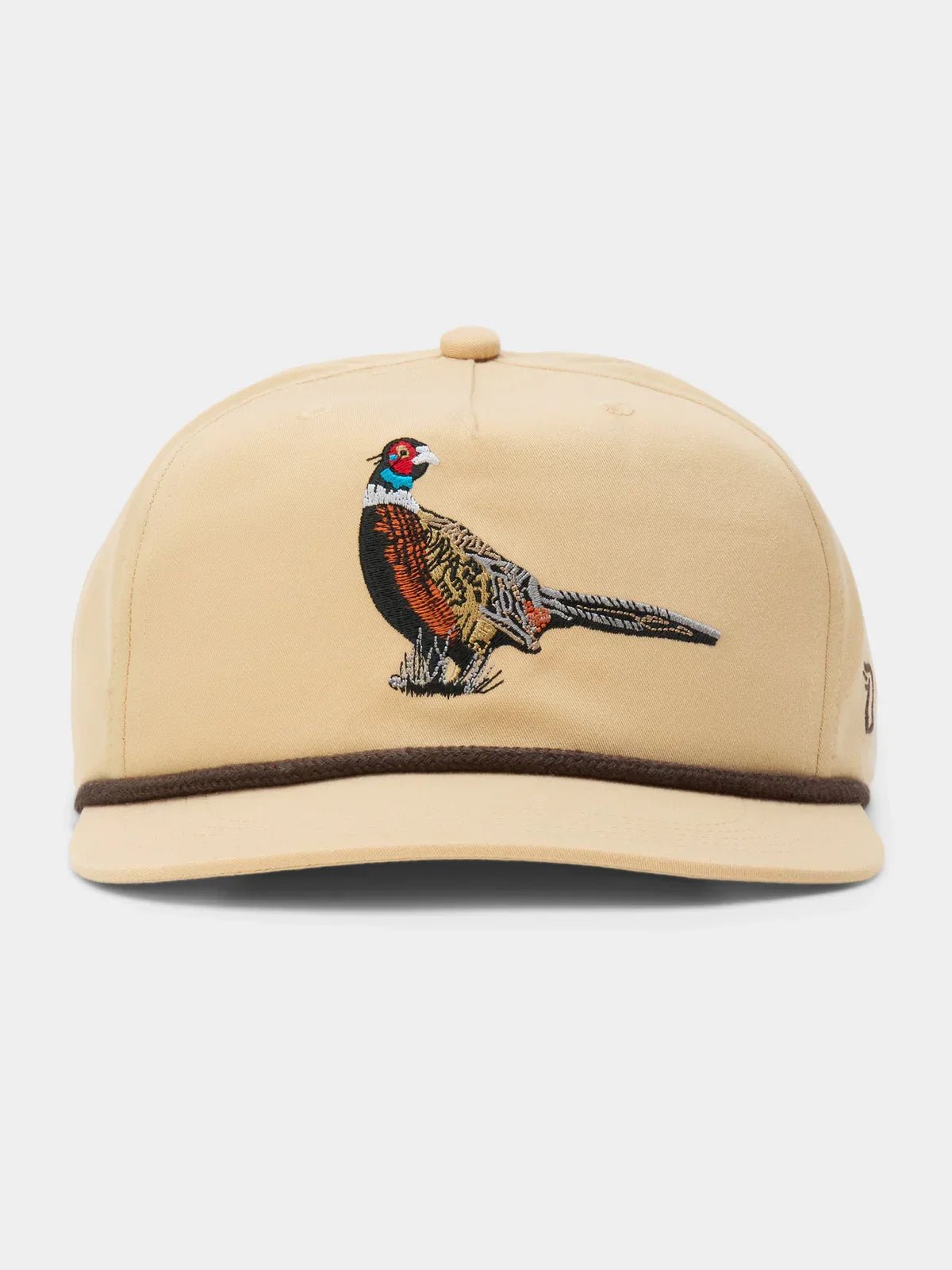 The Duck Camp Pheasant Hat is a beige snapback with a brown band, an embroidered pheasant on the front, adjustable fit, and durable polyester shell.