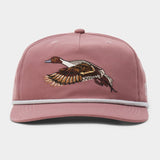 The Duck Camp Pintail Hat is mauve with an embroidered flying duck on the front and a light gray rope above the brim.