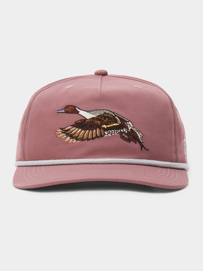 The Duck Camp Pintail Hat is mauve with an embroidered flying duck on the front and a light gray rope above the brim.