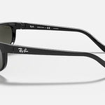 Side view of Ray-Ban 2027 Predator 2 black sunglasses with dark lenses, featuring the Ray-Ban logo on the temple and lens and sporty Predator tips, set against a plain white background.