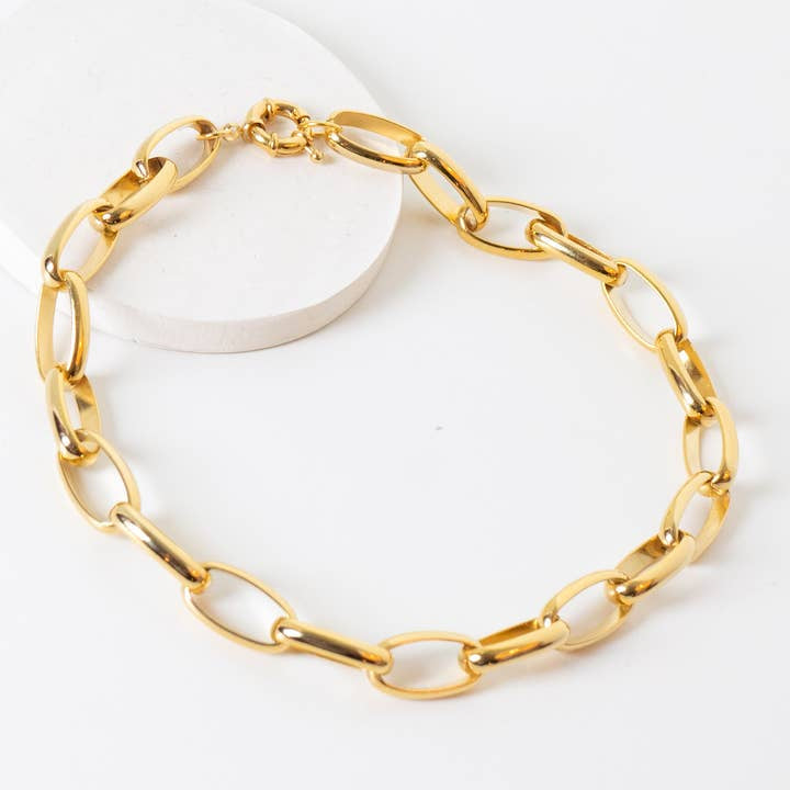 Pretty in Link 24k Gold Plated Necklace by Peter and June features oval links, a lobster clasp, is nickel free and water resistant, and is displayed on a white surface.