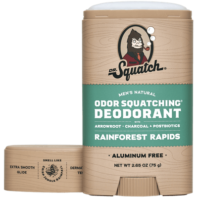A tan and green stick of Dr.Squatch Rainforest Rapids Deodorant, aluminum free with the cap off and ingredients listed.