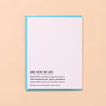 The Reel Good Birthday Card by And Here We Are is a white letterpress card with blue edges reading "AND HERE WE ARE" on the front, business and production info below, and a blank interior.