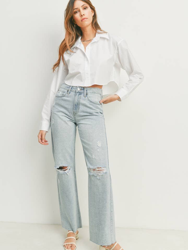 A woman in a white shirt wears the JBD Ribcage Longer Length Straight light denim jeans, featuring a 32-inch inseam and a 9-inch leg opening.