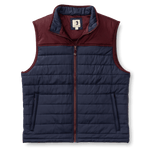 Duck Head Ridgeland Performance Quilted Vest shown flat on a white background; features a maroon yoke, navy body, PrimaLoft® Black Insulation for lightweight warmth, front zipper closure, and two zippered side pockets.