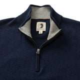 The Ridley 1/4 Zip Sweater by Duck Head features a navy blue design with a light gray inner collar, visible brand label at the neckline, and is machine washable for easy care.