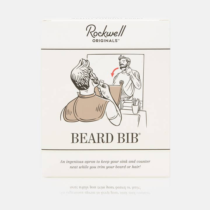 Box of Rockwell Beard Bib by Rockwell Razors, featuring an illustration of a person trimming their beard while wearing the shaving bib hair catcher attached to their neck and mirror.